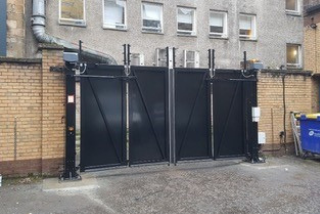 Metallic electric sliding gate installed by Ursa Gates