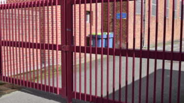 Large,High,Security,Red,Metal,Gate,Closed,Up,For,No